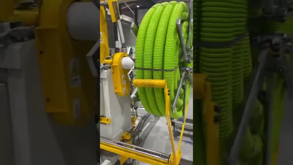 Machine for Coiling Hose and Strapping Automatically. Machine for Coiling Hose and Strapping Automatically.