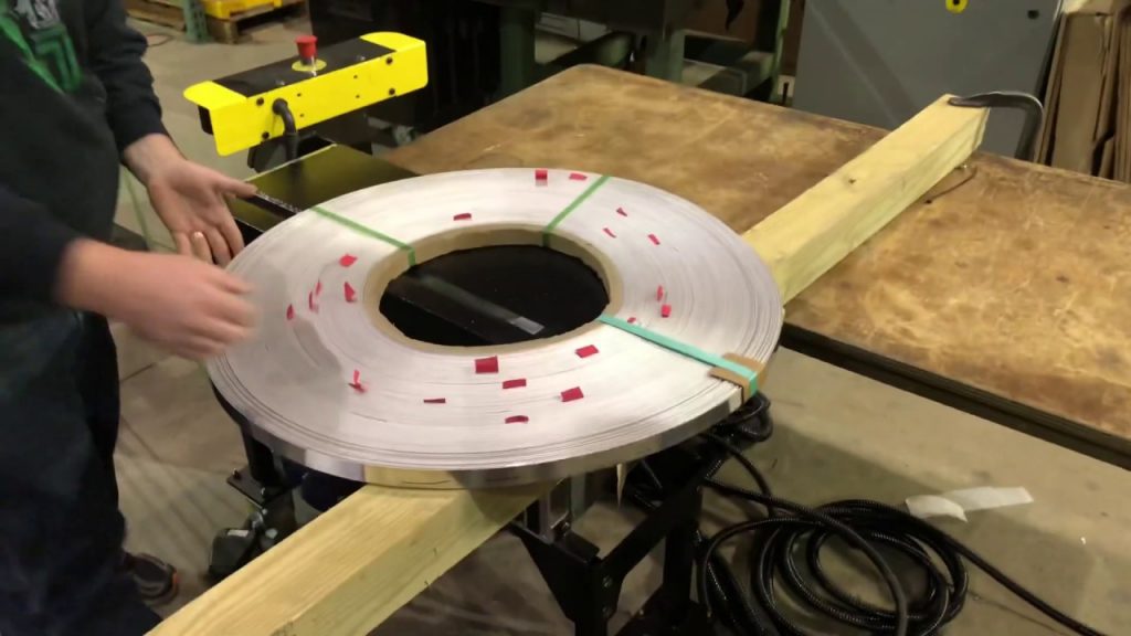Revise title: Strapping Machine with Bottom Seal for PBSU Materials Revise title: Strapping Machine with Bottom Seal for PBSU Materials