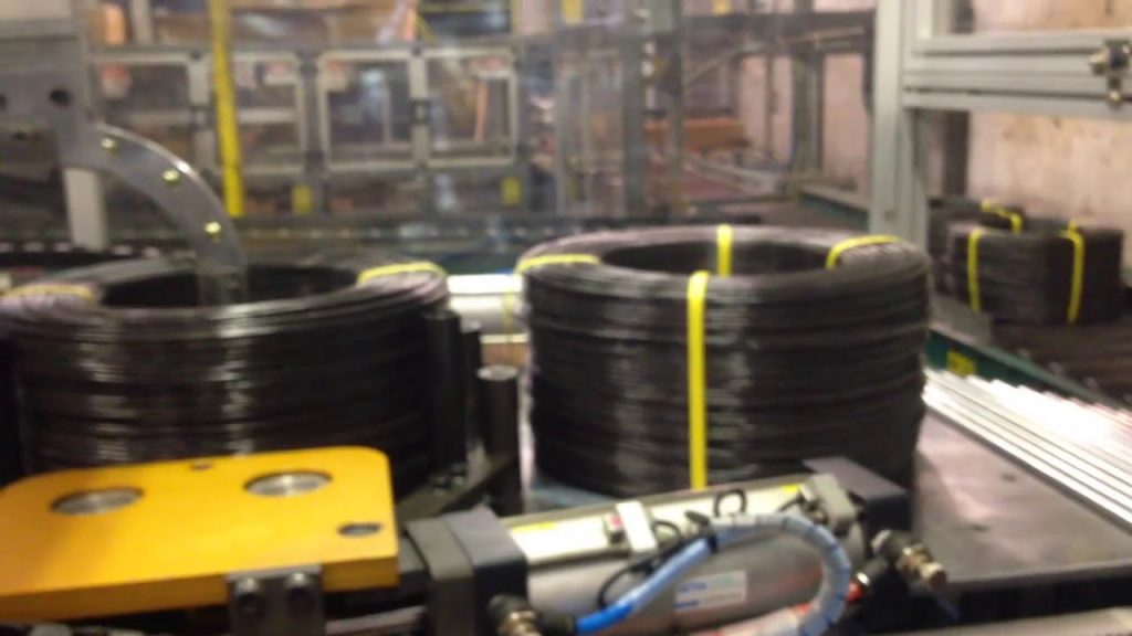 Automatic coiling and strapping machine for steel wire Automatic coiling and strapping machine for steel wire