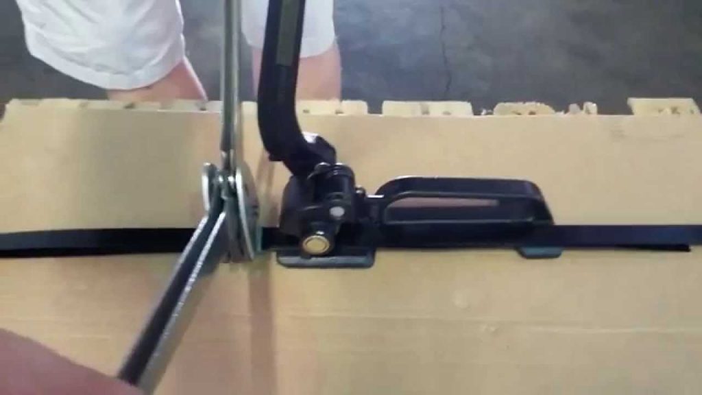 Displaying the Use of a Tool for Tensioning Steel Strapping