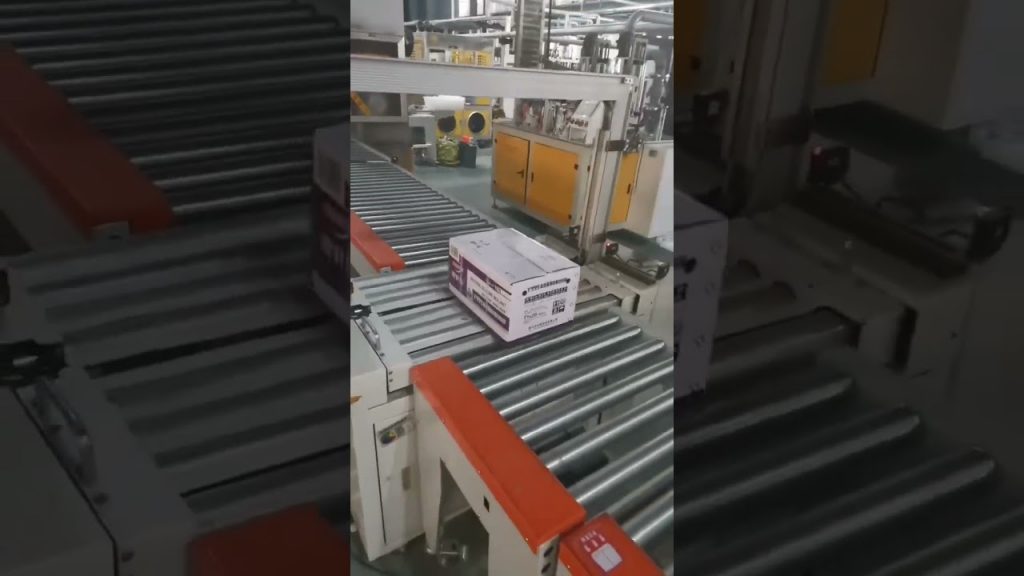 Automated strapping system with robotic functionality. Automated strapping system with robotic functionality.