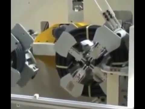 Title: Machine for Coiling and Strapping Pipes Automatically. Title: Machine for Coiling and Strapping Pipes Automatically.