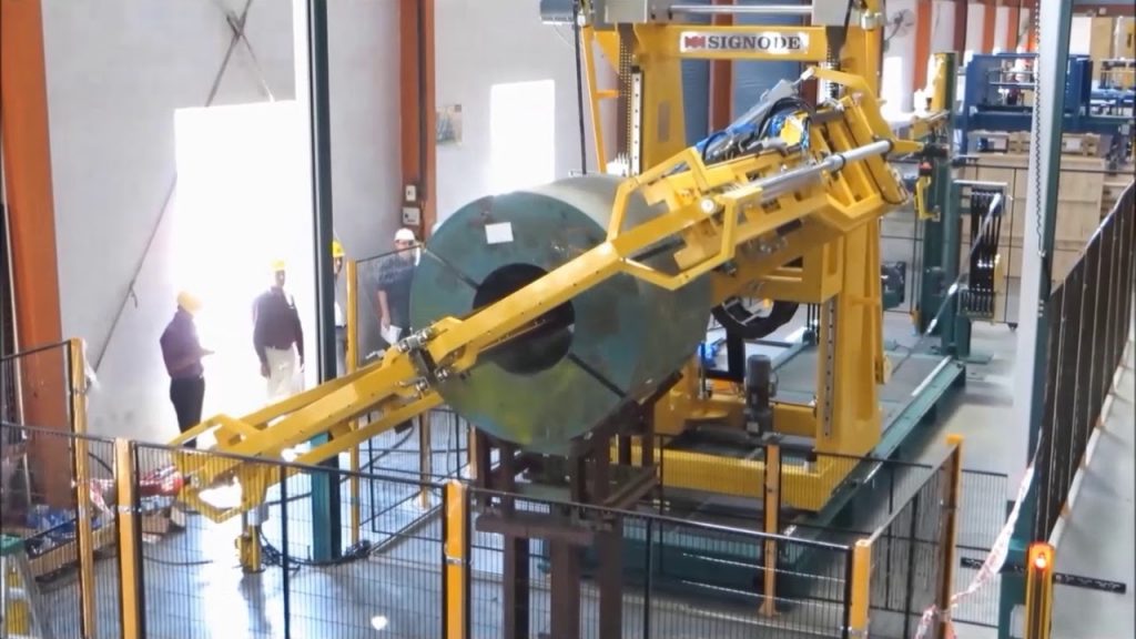 Rewritten: Strapping Machine with EH 2H ROT feature, identified as M410AN 114. Rewritten: Strapping Machine with EH 2H ROT feature, identified as M410AN 114.