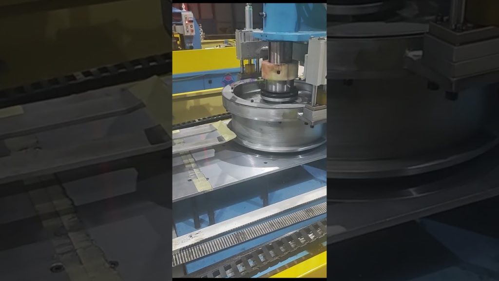 A Winding and Packing Machine for Steel Wire Coils. A Winding and Packing Machine for Steel Wire Coils.