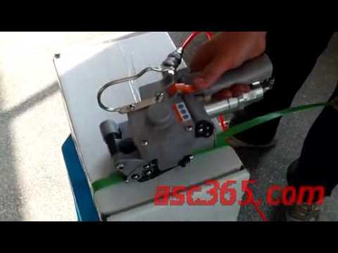 A handheld band strapper operated by air pressure. A handheld band strapper operated by air pressure.