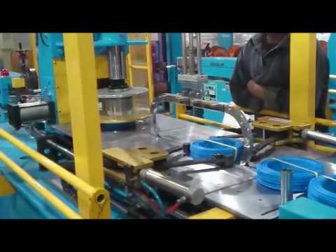 Caption: Coiling and Strapping Machine for Cable Wires Caption: Coiling and Strapping Machine for Cable Wires
