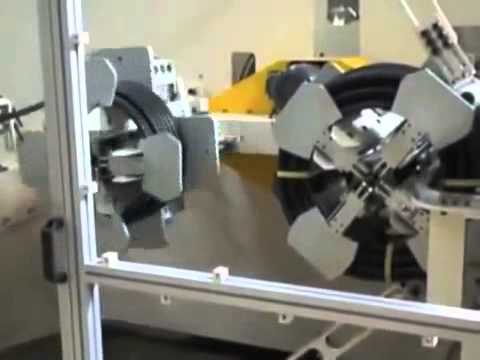 Coiling and Strapping Machine for Hoses and Pipes.