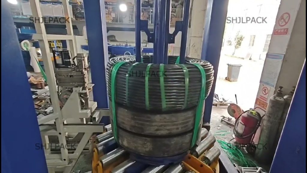 An automated strapping machine for coils An automated strapping machine for coils